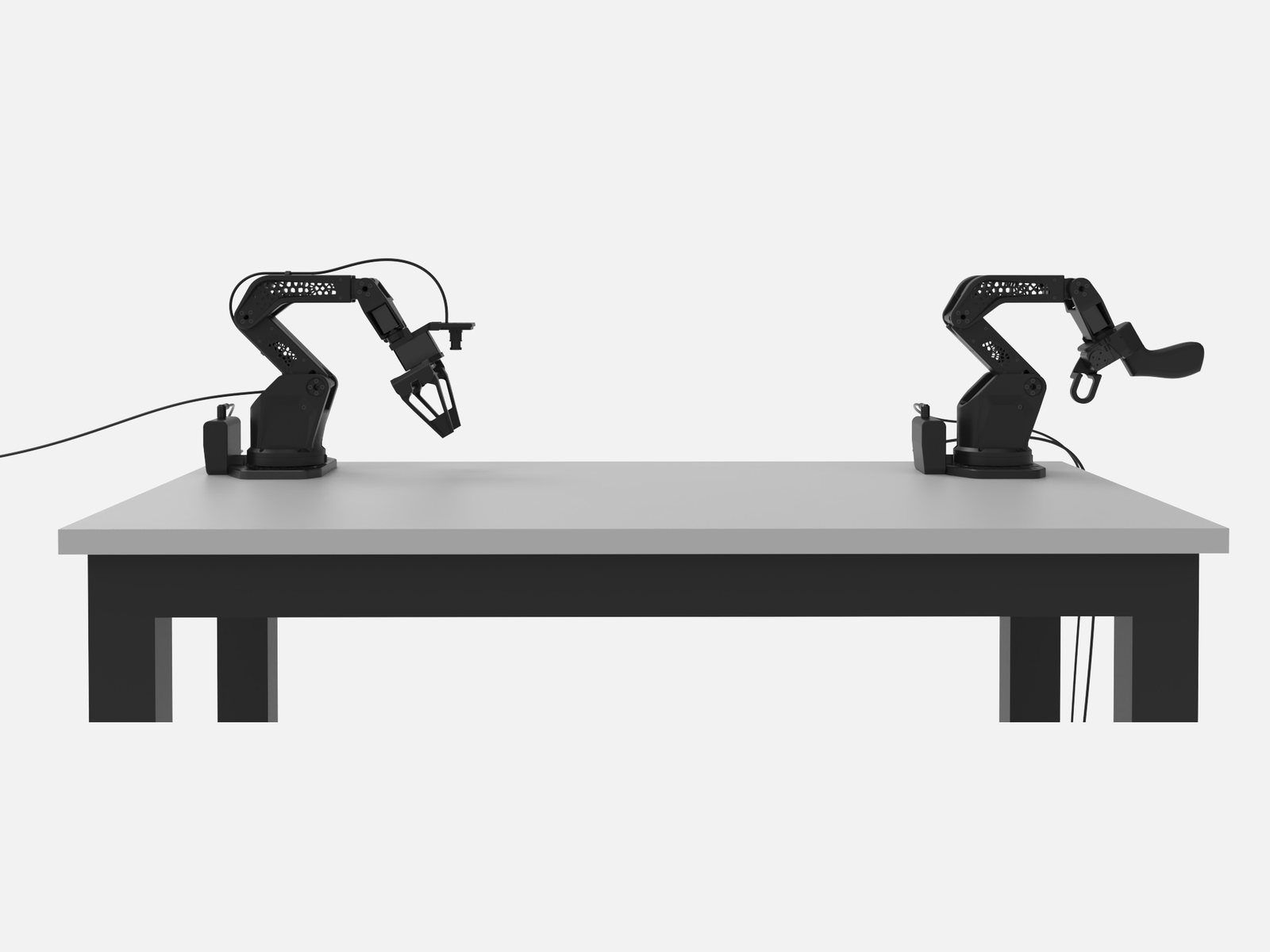Leader and follower on a desk, ready for teleoperation.